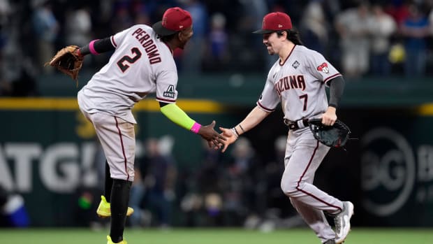 Diamondbacks players Geraldo Perdomo (2) and Corbin Carroll (7) celebrate after Game 2 of the World Series.